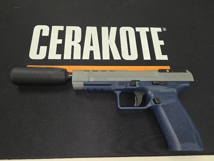 Canik TP9SFX Cerakoted in H-127 Kel-Tec Navy Blue with an H-213 Battleship Grey slide, left side, SAW Shiv suppressor fitted