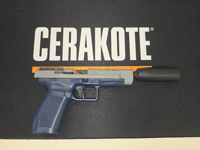 Right side of the Navy Blue and Battleship Grey Cerakote Canik TP9SFX with threaded barrel and SAW Shiv suppressor by Stealth Additive Works