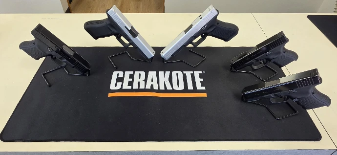 Five Glocks Cerakoted with H-146 Graphite Black frames, three H-109 Gloss Black slides and two H-151 Satin Aluminum
