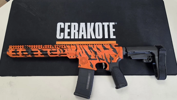 TNSW TN-15 12.5 inch AR pistol Cerakoted in H-128 Hunter Orange with H-146 Graphite Black tiger stripes, left side